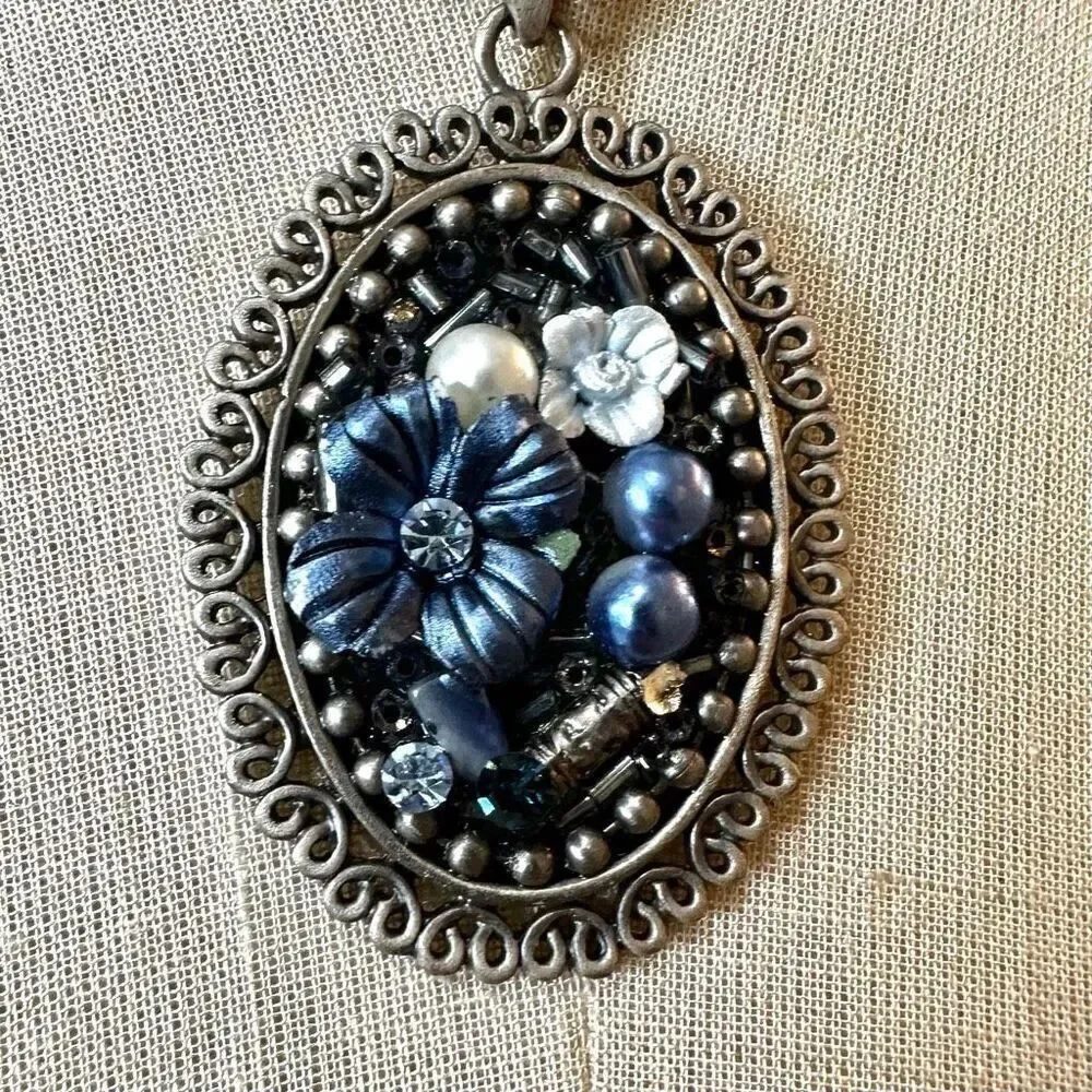 Blue floral beaded pendant necklace on multi cord